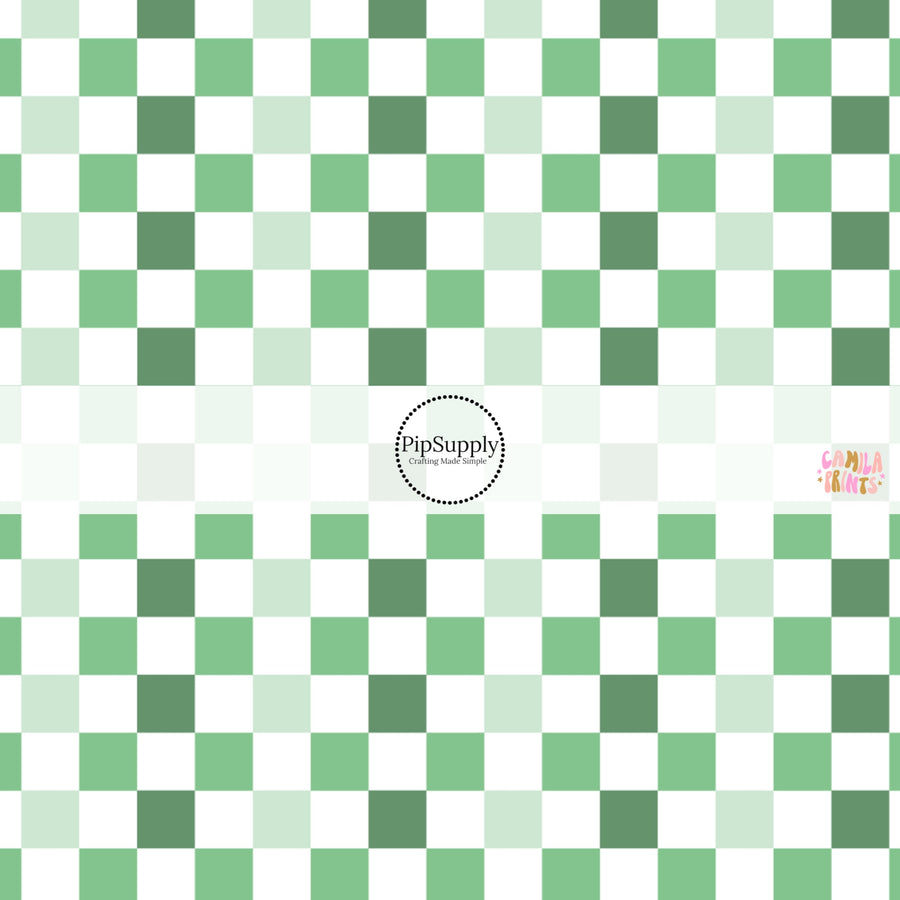 This holiday fabric by the yard features green and cream checkers. This festive pattern fabric can be used for all your sewing and crafting needs!