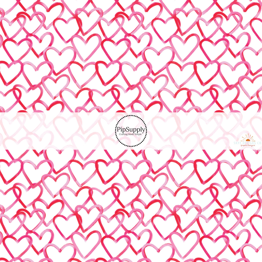 This holiday fabric by the yard features red and pink hearts. This festive pattern fabric can be used for all your sewing and crafting needs!