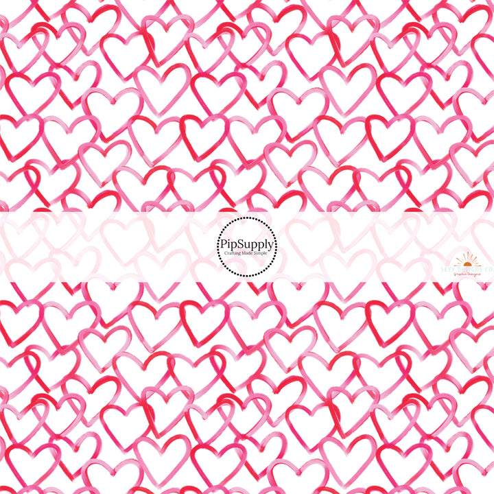 This holiday fabric by the yard features red and pink hearts. This festive pattern fabric can be used for all your sewing and crafting needs!