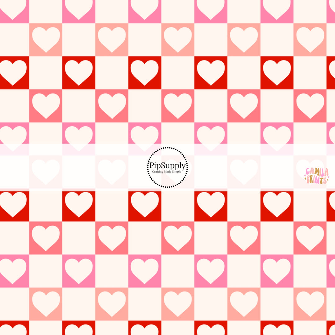 This holiday fabric by the yard features hearts on cream, red and pink checkers. This festive pattern fabric can be used for all your sewing and crafting needs!