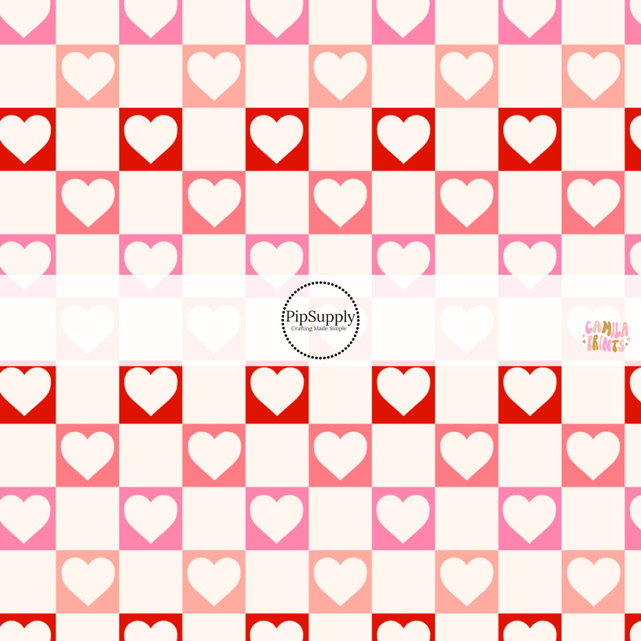 This holiday fabric by the yard features hearts on cream, red and pink checkers. This festive pattern fabric can be used for all your sewing and crafting needs!