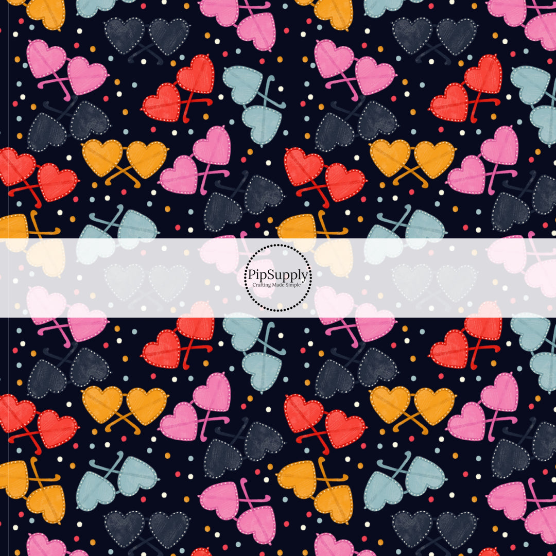 This holiday fabric by the yard features colorful heart glasses on black. This festive pattern fabric can be used for all your sewing and crafting needs!