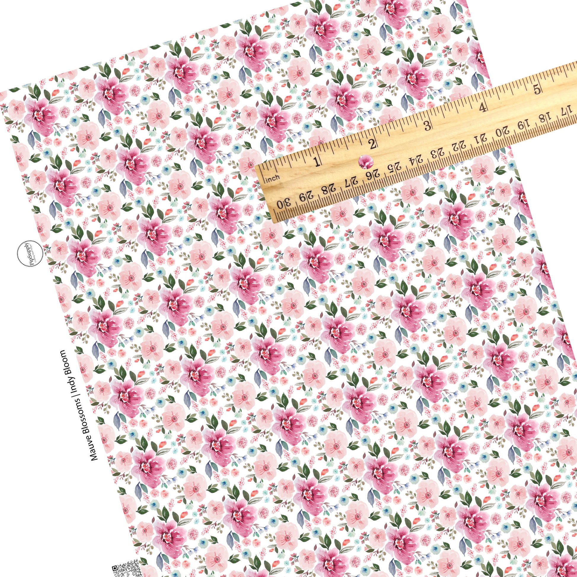 These pastel watercolor flowers on a white faux leather sheets contain the following design elements: light pink, peach, blue, teal, purple, green, and olive beautiful flowers and leaves.