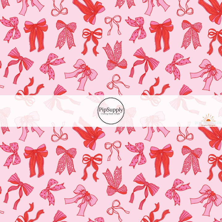 This holiday fabric by the yard features red and pink bows. This festive pattern fabric can be used for all your sewing and crafting needs!