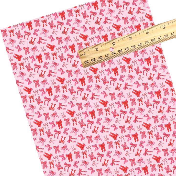 These holiday faux leather sheets contain the following design elements: red and pink bows. Our CPSIA compliant faux leather sheets or rolls can be used for all types of crafting projects.