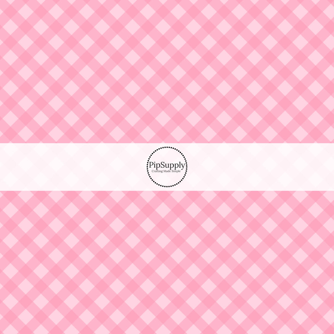 These spring fabric by the yard features pink diagonal gingham pattern. This fun pattern fabric can be used for all your sewing and crafting needs!