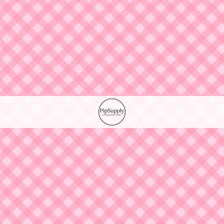 These spring fabric by the yard features pink diagonal gingham pattern. This fun pattern fabric can be used for all your sewing and crafting needs!