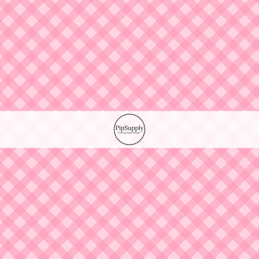 These spring fabric by the yard features pink diagonal gingham pattern. This fun pattern fabric can be used for all your sewing and crafting needs!