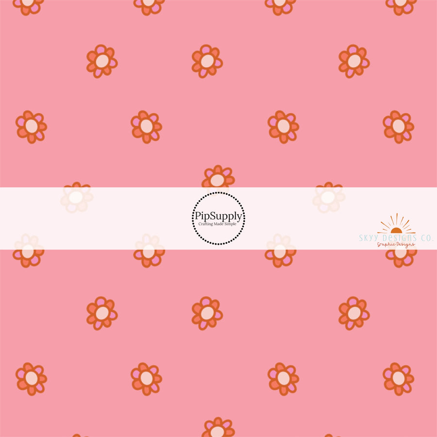 These Halloween themed pattern fabric by the yard features the following design elements: tiny flowers on pink. This fun spooky themed fabric can be used for all your sewing and crafting needs!