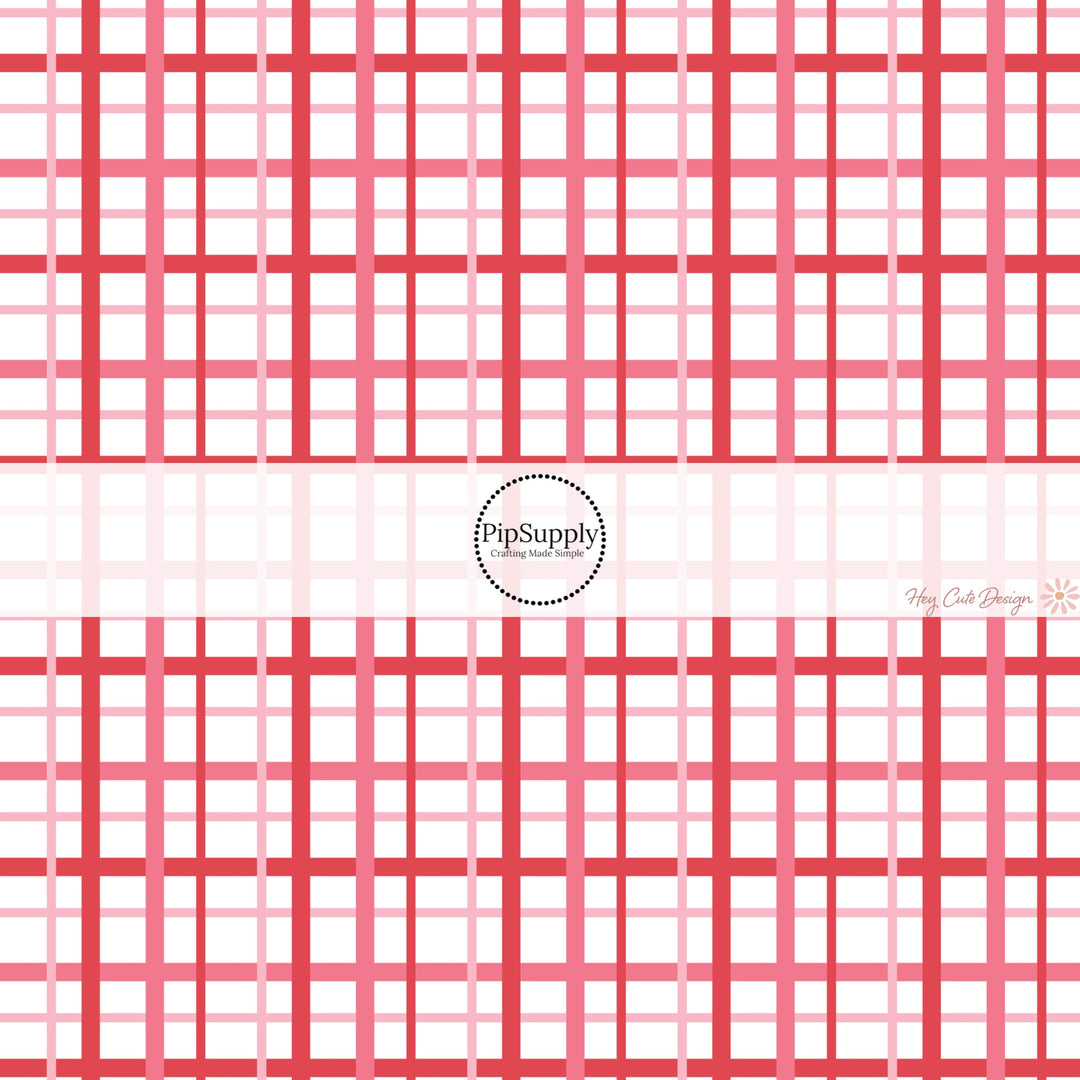 This holiday fabric by the yard features red and pink gingham pattern. This festive pattern fabric can be used for all your sewing and crafting needs!