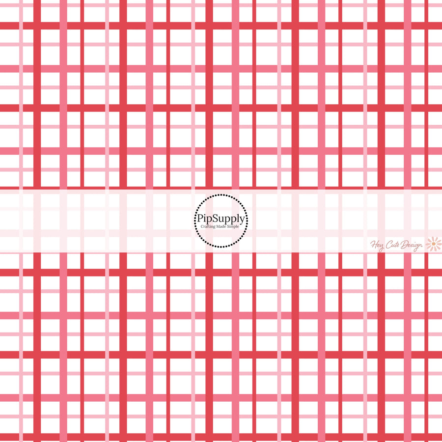 This holiday fabric by the yard features red and pink gingham pattern. This festive pattern fabric can be used for all your sewing and crafting needs!