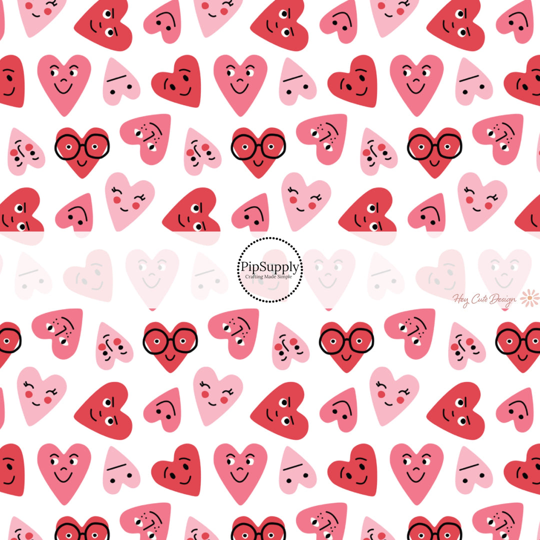 This holiday fabric by the yard features red and pink smiley hearts. This festive pattern fabric can be used for all your sewing and crafting needs!