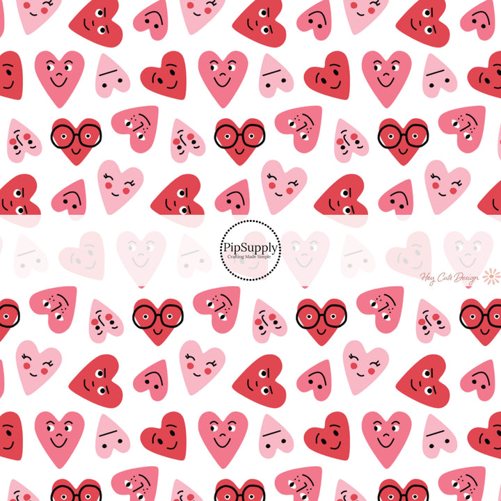 This holiday fabric by the yard features red and pink smiley hearts. This festive pattern fabric can be used for all your sewing and crafting needs!