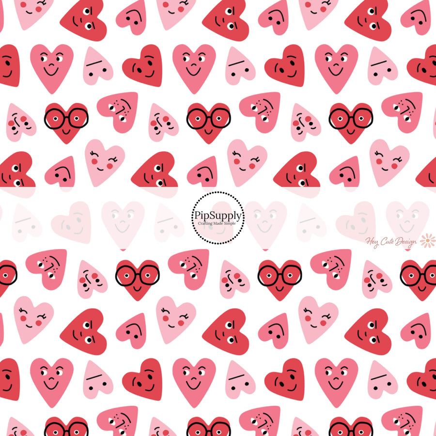 This holiday fabric by the yard features red and pink smiley hearts. This festive pattern fabric can be used for all your sewing and crafting needs!