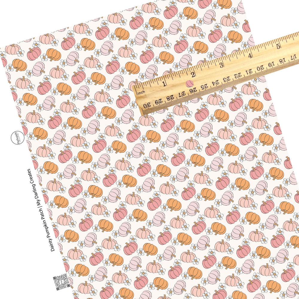 Floral multi pumpkins on cream faux leather sheets