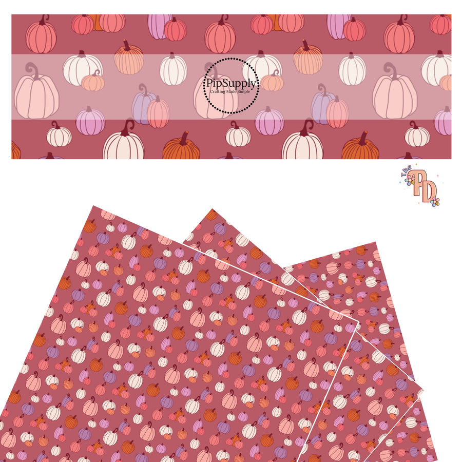 Pink, purple, orange, and cream pumpkins on mauve faux leather sheets