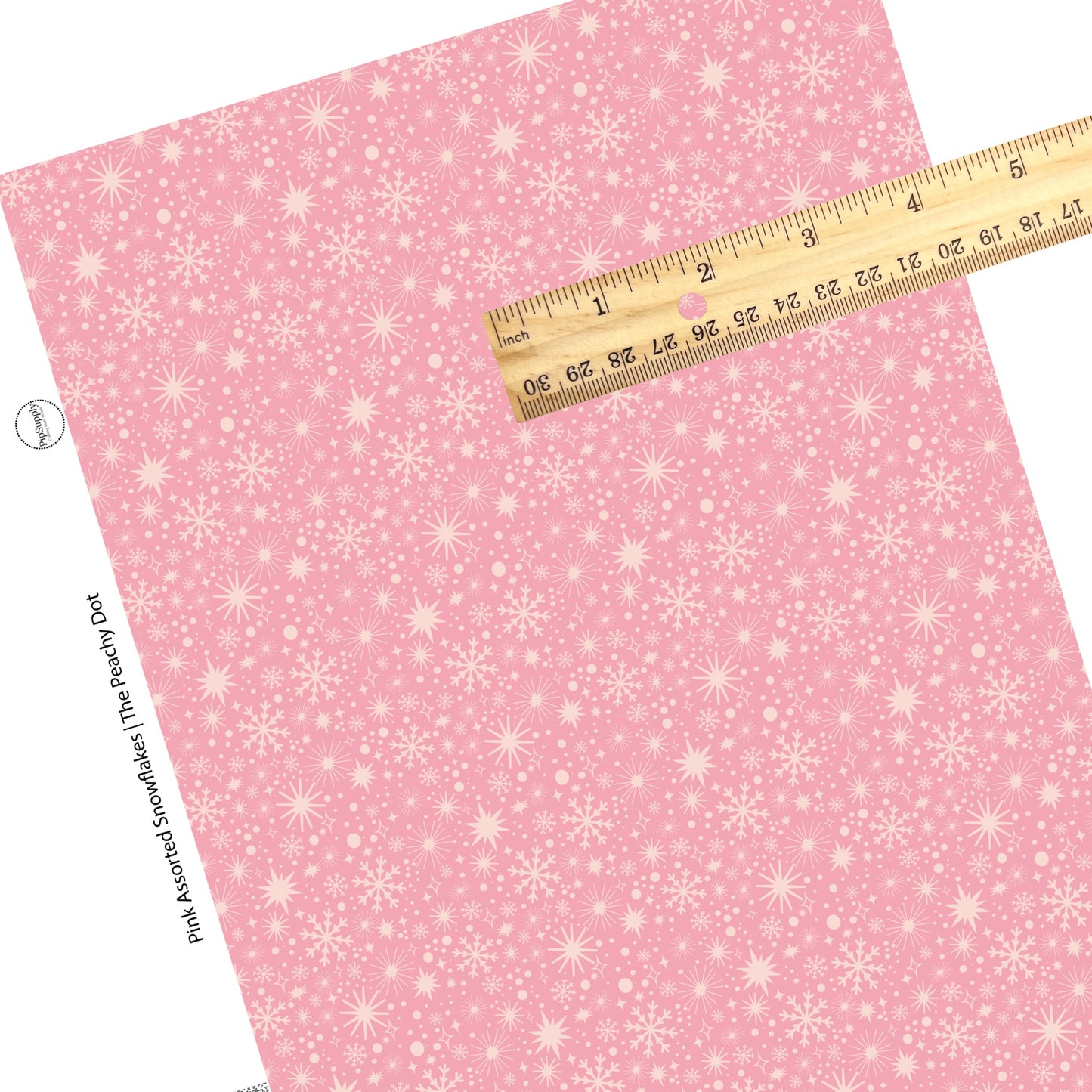 Scattered multi snowflakes on pink faux leather sheets