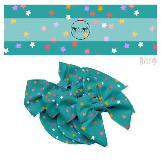 Gold, white, pink, and purple scattered stars on teal bow strips