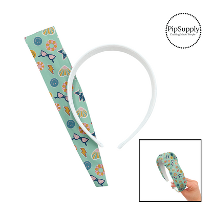 Heart, lightning bolt, glasses,flowers, good vibes, and smiley faces on aqua knotted headband kit