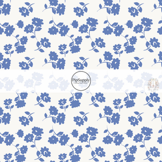These floral themed light cream fabric by the yard features periwinkle flowers on cream. This fun summer floral themed fabric can be used for all your sewing and crafting needs! 