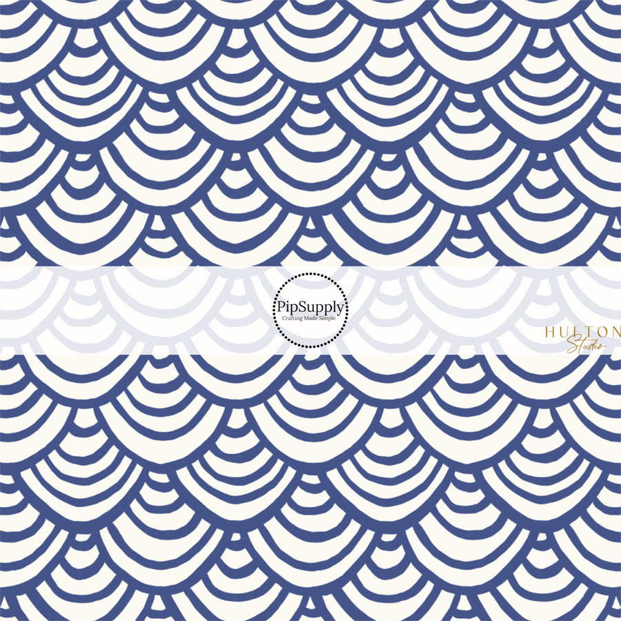 This summer fabric by the yard features blue and white scallop patterns. This fun themed fabric can be used for all your sewing and crafting needs!