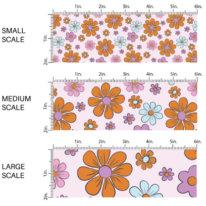 This scale chart for small scale, medium scale, and large scale of these Halloween floral themed pink fabric by the yard features small and large bright daisies in pink, purple, light blue, and orange on pastel pink. This fun spooky themed fabric can be used for all your sewing and crafting needs! 
