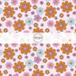 These Halloween floral themed pink fabric by the yard features small and large bright daisies in pink, purple, light blue, and orange on pastel pink. This fun spooky themed fabric can be used for all your sewing and crafting needs! 