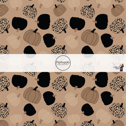 Light brown pumpkin with leopard spots with falling black and brown pumpkins hair bow strips