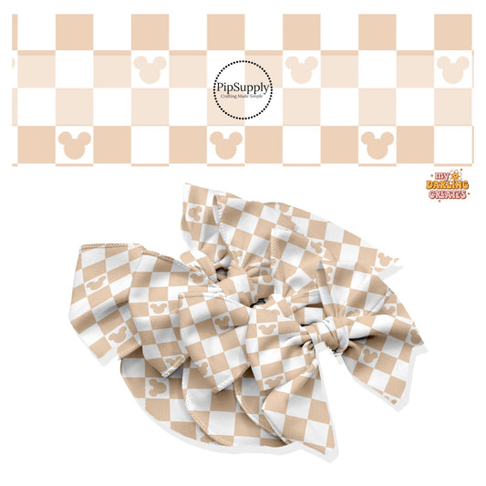 These magical inspired themed no sew bow strips can be easily tied and attached to a clip for a finished hair bow. These fun themed patterned bow strips are great for personal use or to sell. These bow strips feature the following nude and cream checker pattern with mouse ears.