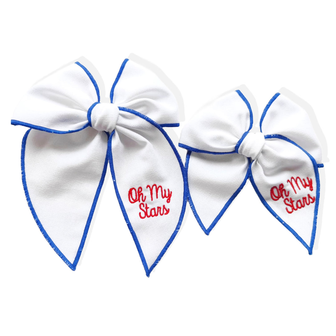 These patriotic linen pre-cut tied bows are ready to package and resell to your customers no sewing or measuring necessary! These hair bows come with a clip already attached. The linen bow has blue stitching and "Oh' My Stars" embroidered saying.