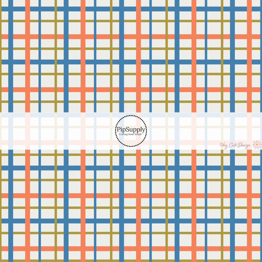 This holiday fabric by the yard features orange, blue, and green gingham pattern. This festive pattern fabric can be used for all your sewing and crafting needs!