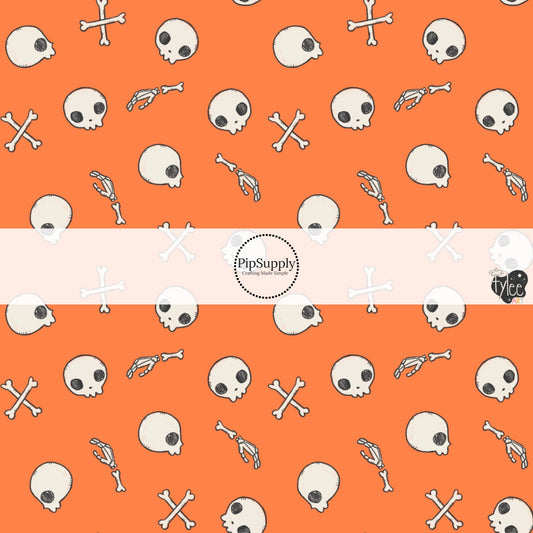 These Halloween themed pattern fabric by the yard features the following design elements: skulls and bones on orange. This fun spooky themed fabric can be used for all your sewing and crafting needs!