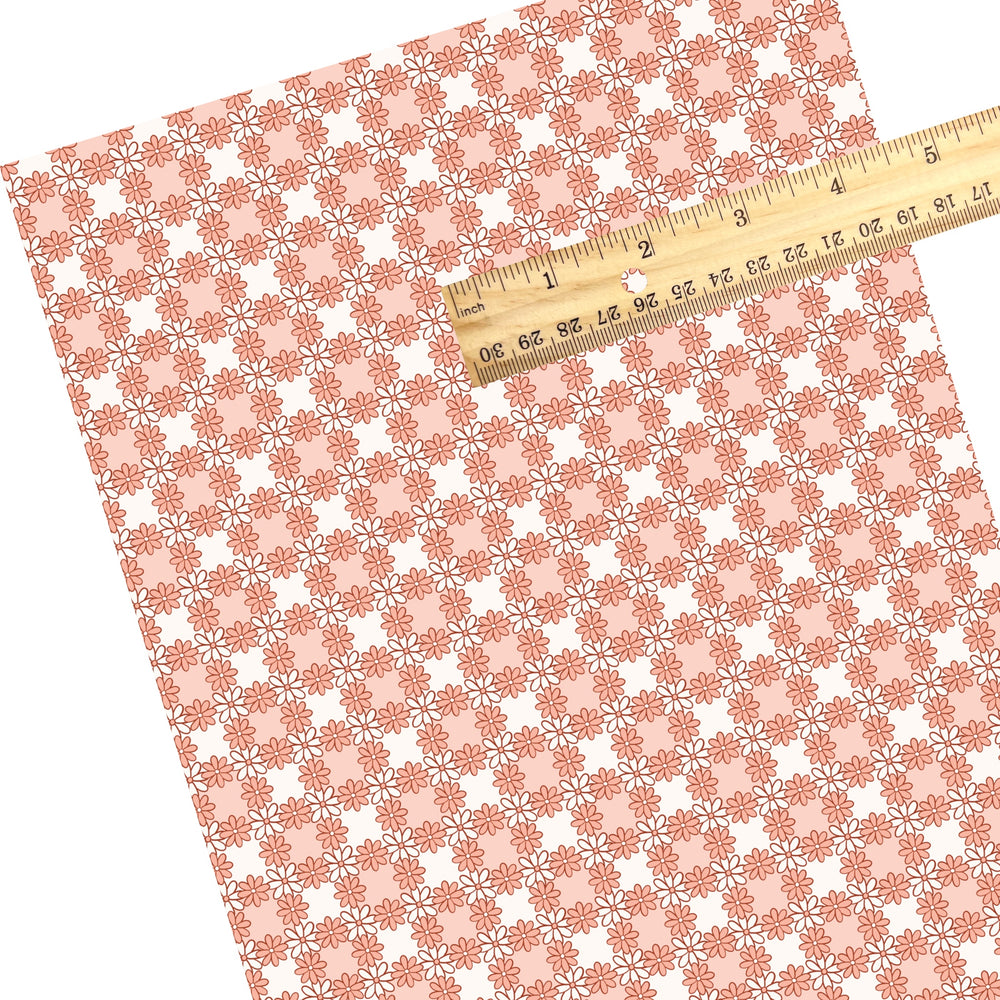 These Easter themed faux leather sheets contain the following design elements: orange daisy flowers on a checker pattern. Our CPSIA compliant faux leather sheets or rolls can be used for all types of crafting projects.