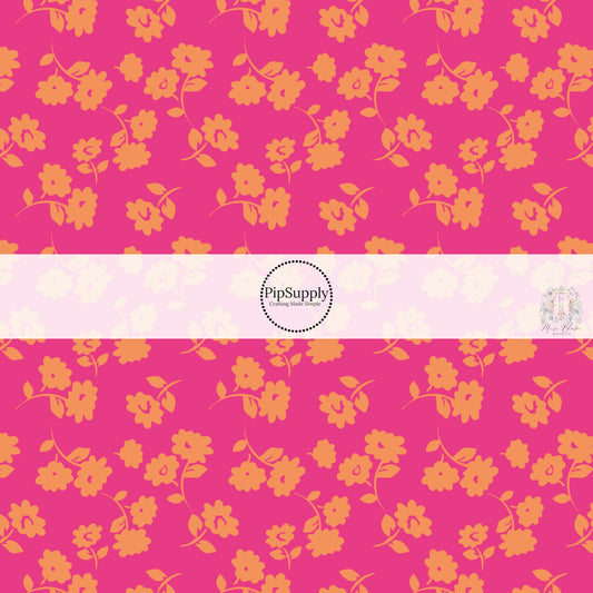 These floral themed hot pink fabric by the yard features orange flowers on hot pink. This fun summer floral themed fabric can be used for all your sewing and crafting needs! 