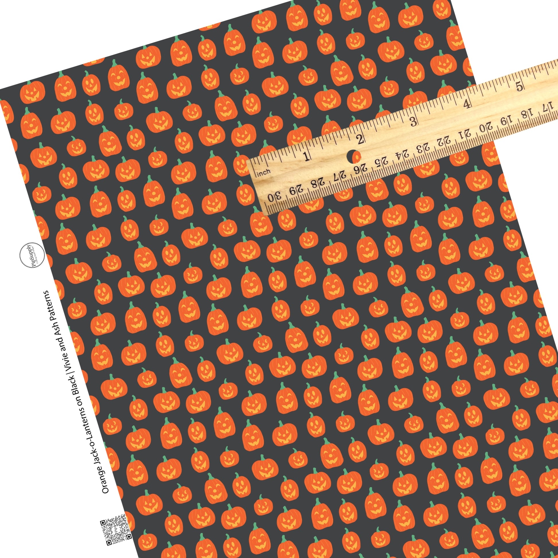 Halloween pumpkins on black faux leather sheets