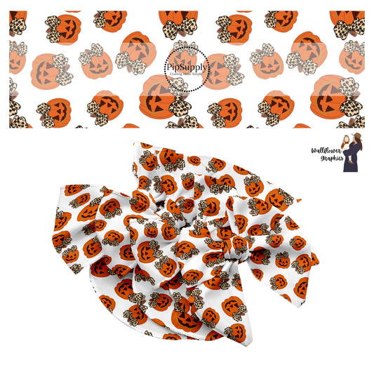 Orange happy face pumpkins with leopard bows on white hair bow strips