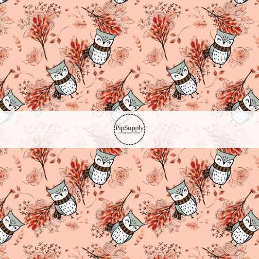 These fall themed peach fabric by the yard features autumn branches and leaves with owls on light pink. This fun fall themed fabric can be used for all your sewing and crafting needs! 