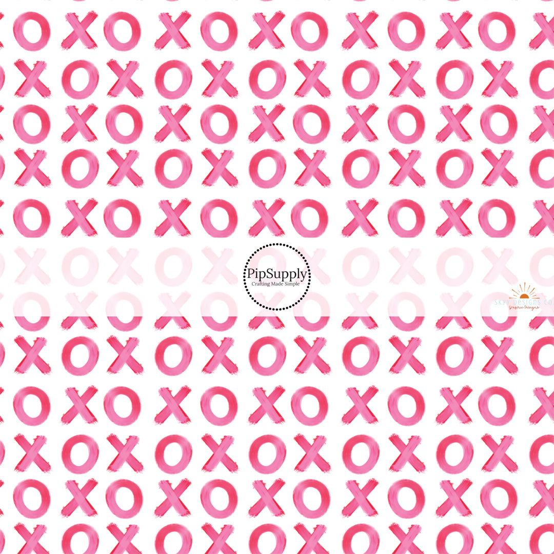 This holiday fabric by the yard features pink XOs. This festive pattern fabric can be used for all your sewing and crafting needs!