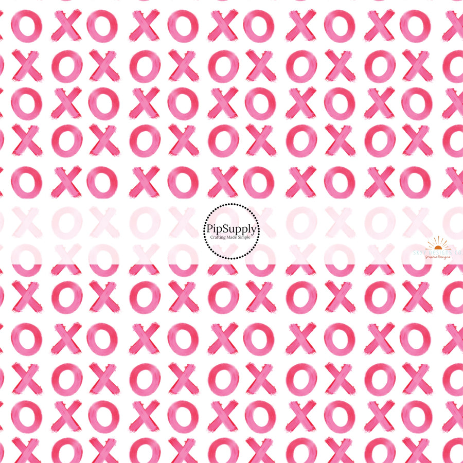 This holiday fabric by the yard features pink XOs. This festive pattern fabric can be used for all your sewing and crafting needs!