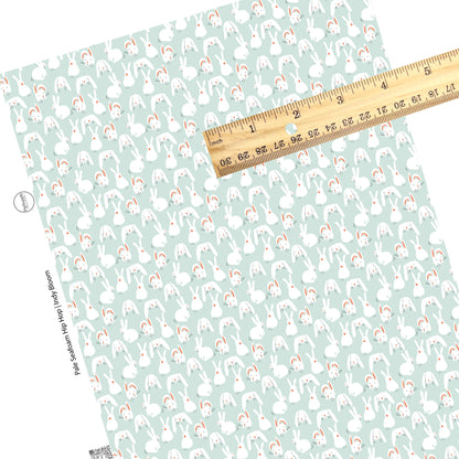 These spring pattern themed faux leather sheets contain the following design elements: bunnies on light seafoam. Our CPSIA compliant faux leather sheets or rolls can be used for all types of crafting projects.