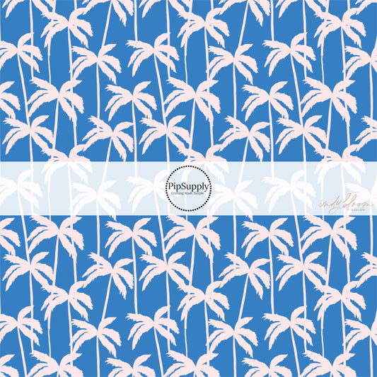 This summer fabric by the yard features palm trees on blue. This fun themed fabric can be used for all your sewing and crafting needs!