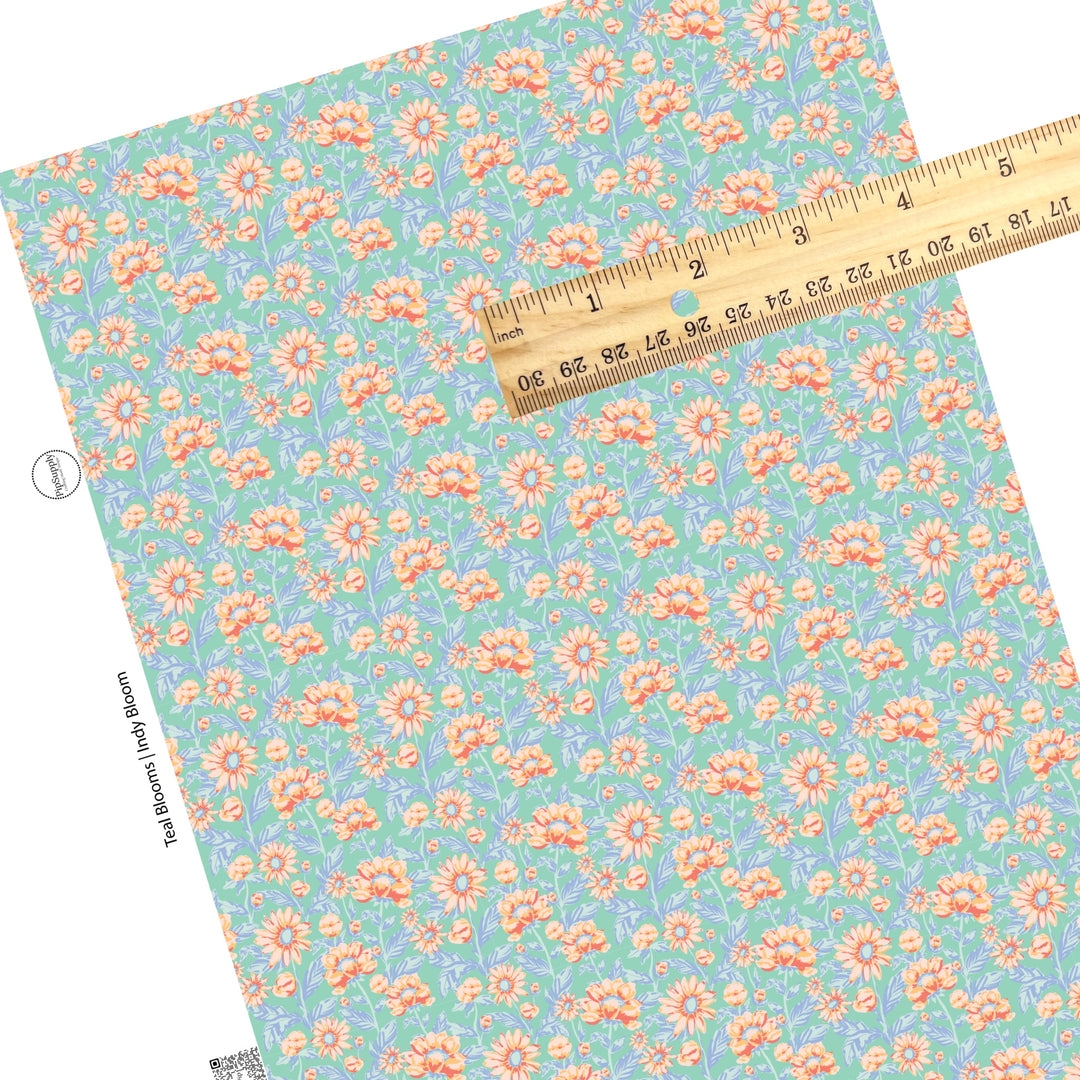 These pastel watercolor blooms on blue faux leather sheets contain the following design elements: light pink, peach, and light blue beautiful flowers and leaves.