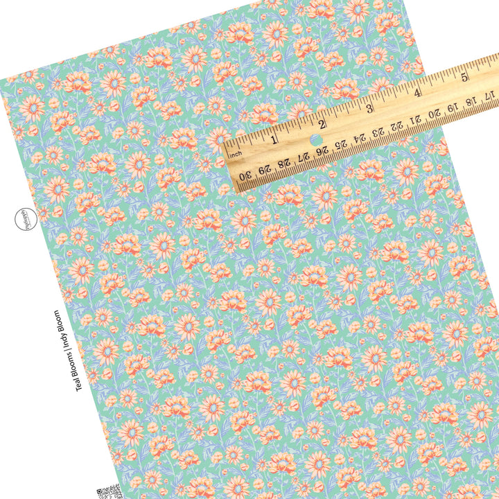 These pastel watercolor blooms on blue faux leather sheets contain the following design elements: light pink, peach, and light blue beautiful flowers and leaves.