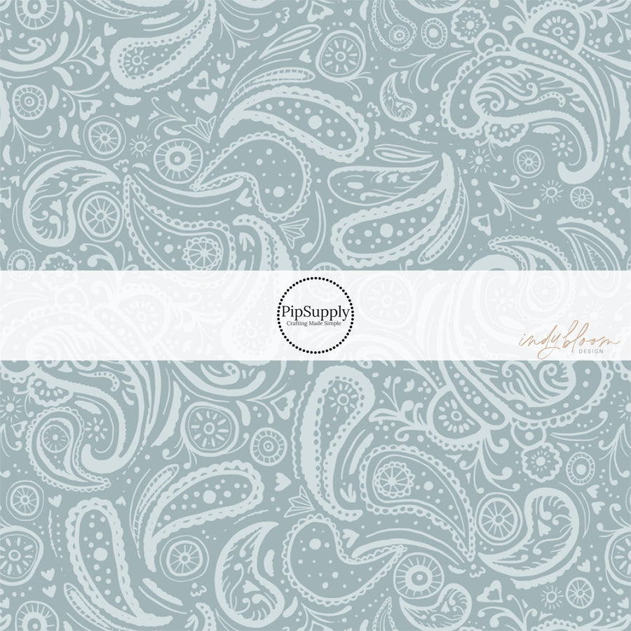 These western light blue fabric by the yard features light blue gray paisley pattern.