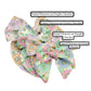 Group photo of the pastel flowers on a pastel checkered pattern hair bow strips with pattern names. 