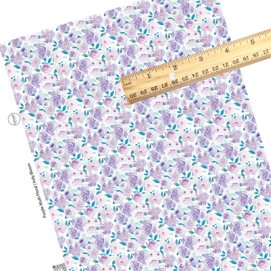 These pastel watercolor flowers on white faux leather sheets contain the following design elements: flowers in the colors of light blue, teal, purple, and lavender. 