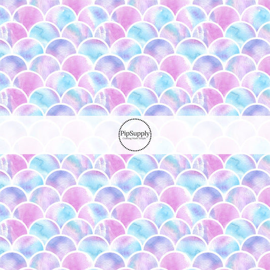This beach fabric by the yard features pink, purple, and blue mermaid scales. This fun summer themed fabric can be used for all your sewing and crafting needs!