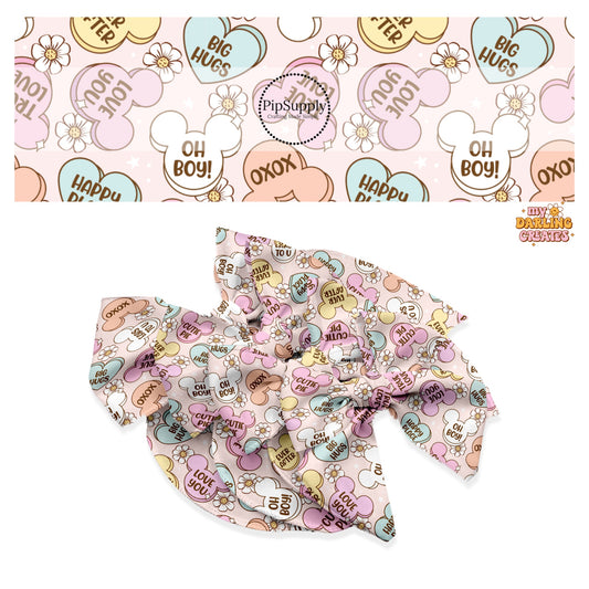 White flowers and pastel mouse heads and candy with sayings on pink hair bow strips