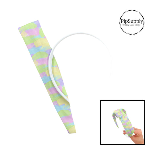 These spring patterned headband kits are easy to assemble and come with everything you need to make your own knotted headband. These kits include a custom printed and sewn fabric strip and a coordinating velvet headband. This cute pattern features pastel pink, yellow, green, purple, and blue paint strokes. 