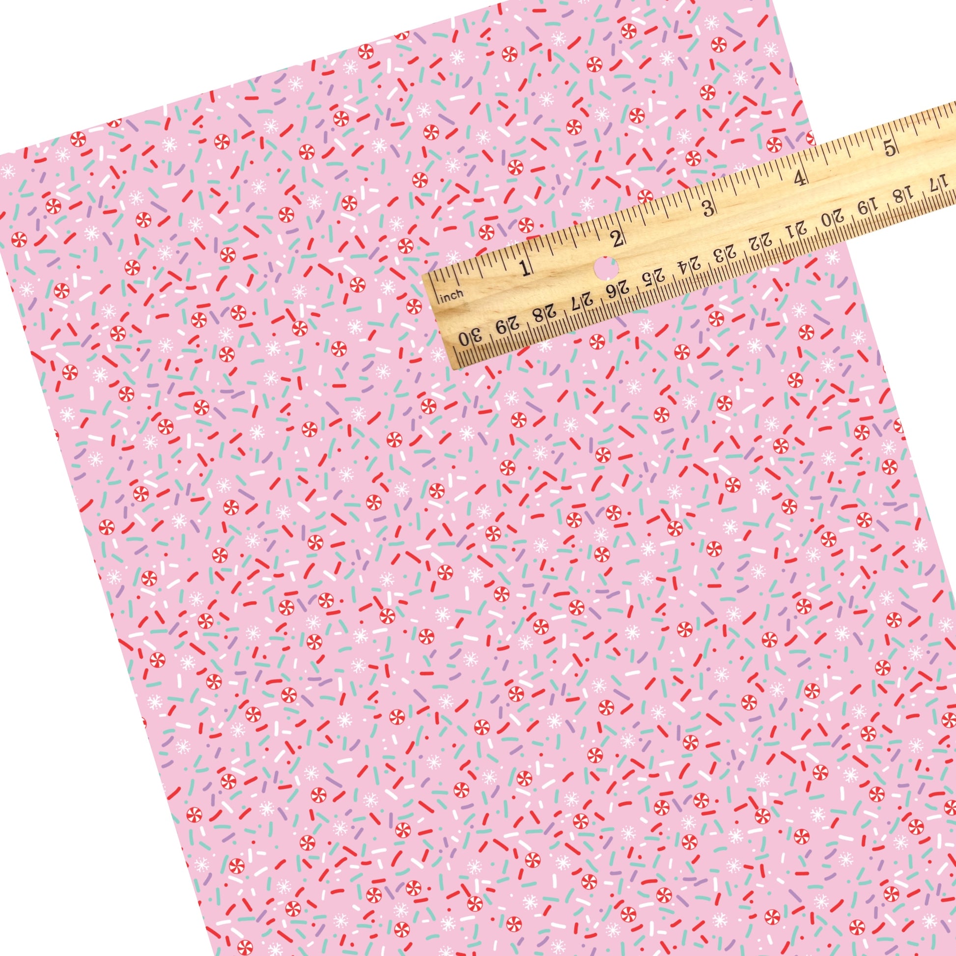 These Christmas themed pattern faux leather sheets contain the following design elements: peppermint sprinkles on pink. Our CPSIA compliant faux leather sheets or rolls can be used for all types of crafting projects.